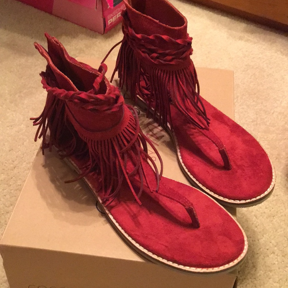 Red suede flip flop sandals with fringe